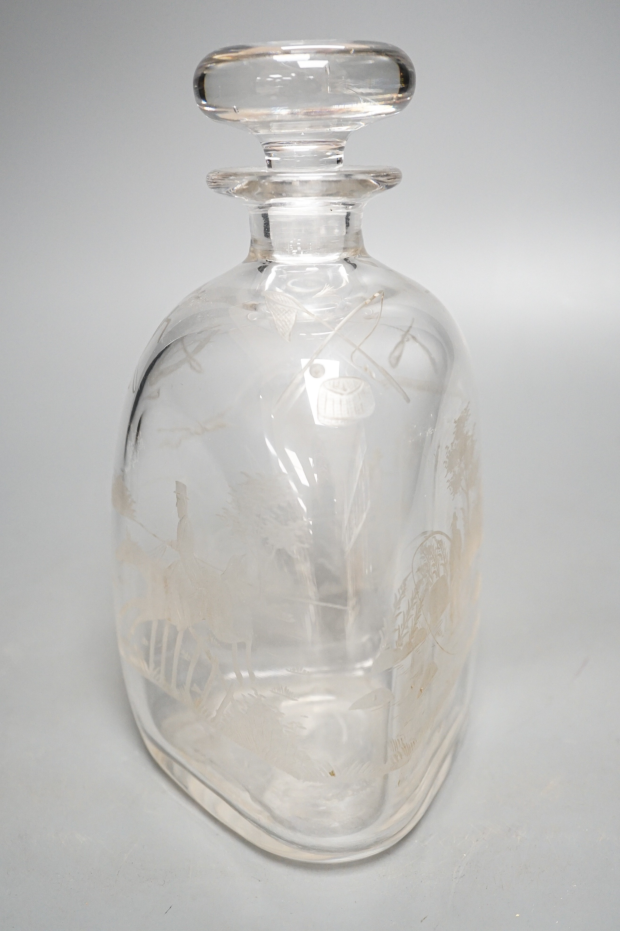 Hunting interest - A Victorian wheel engraved triangular glass decanter, and stopper, 22 cms high.